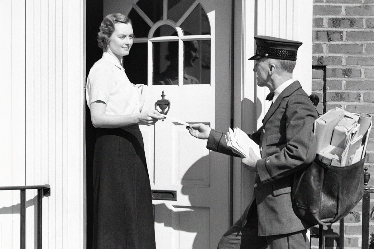 Postman delivering letter