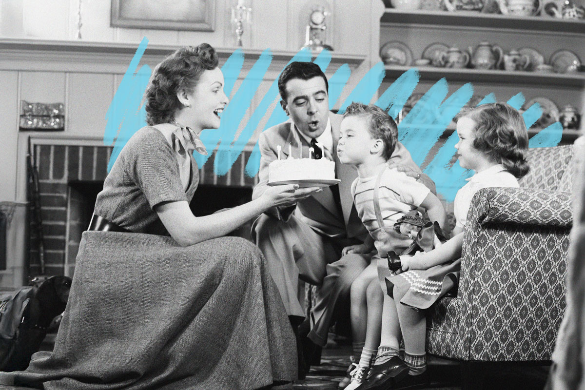 Family celebrating child's birthday, 1950s