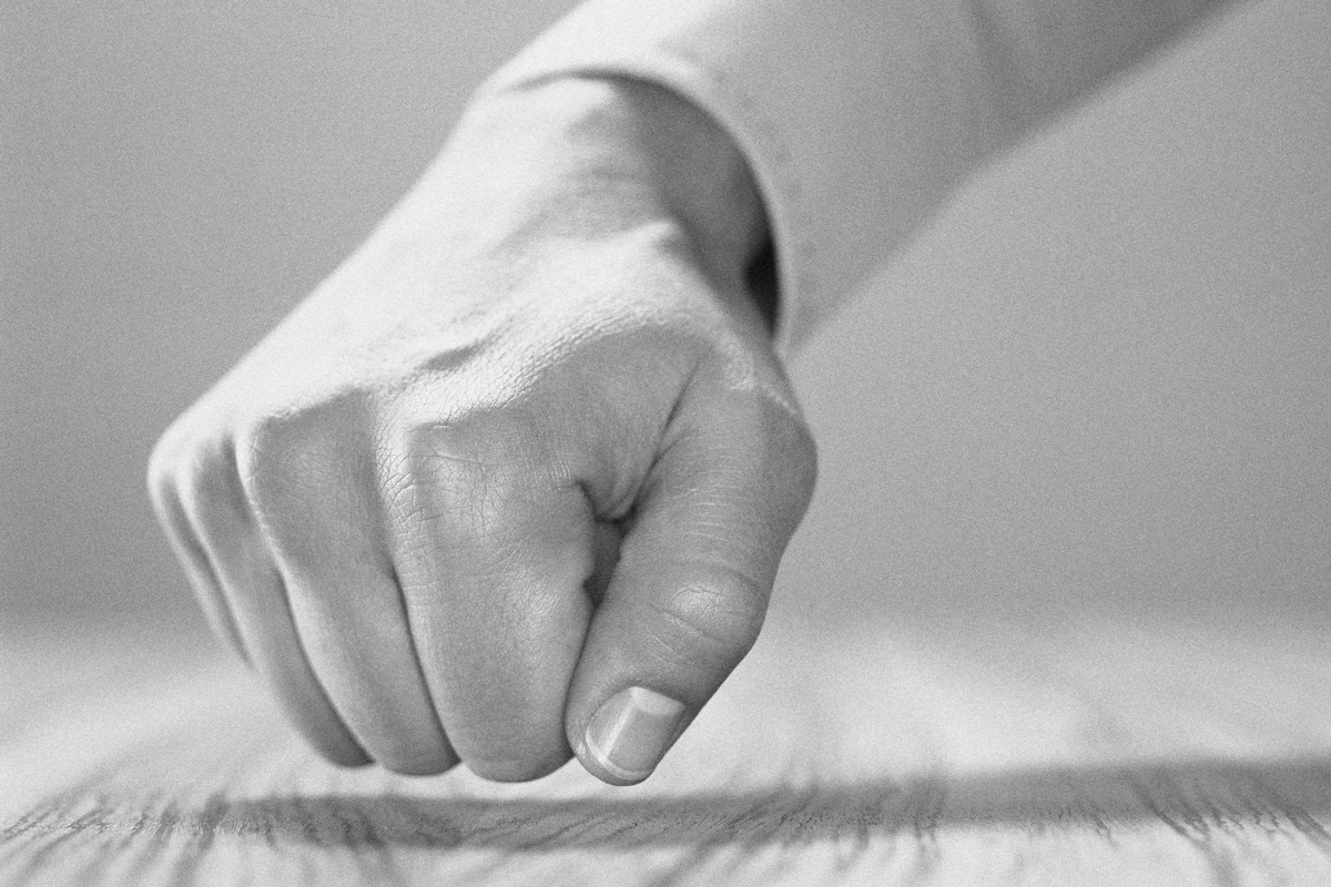 Man knocking on wood