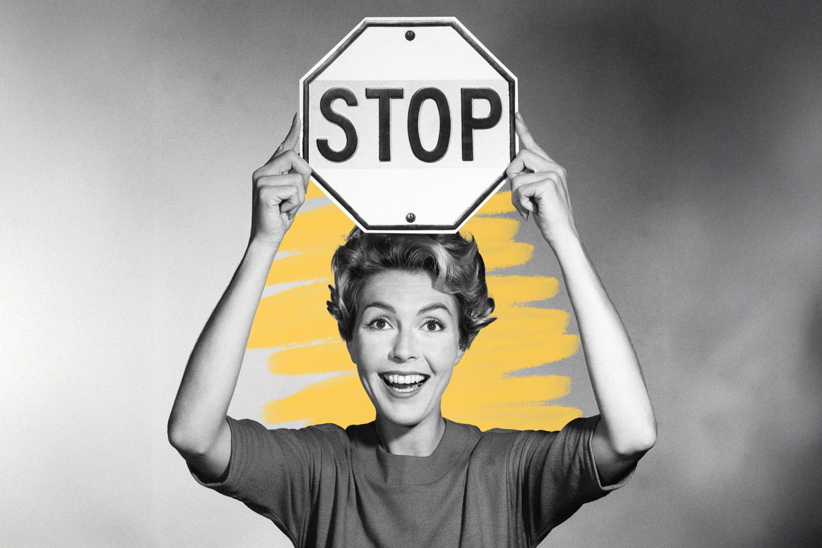 Woman holding a stop sign